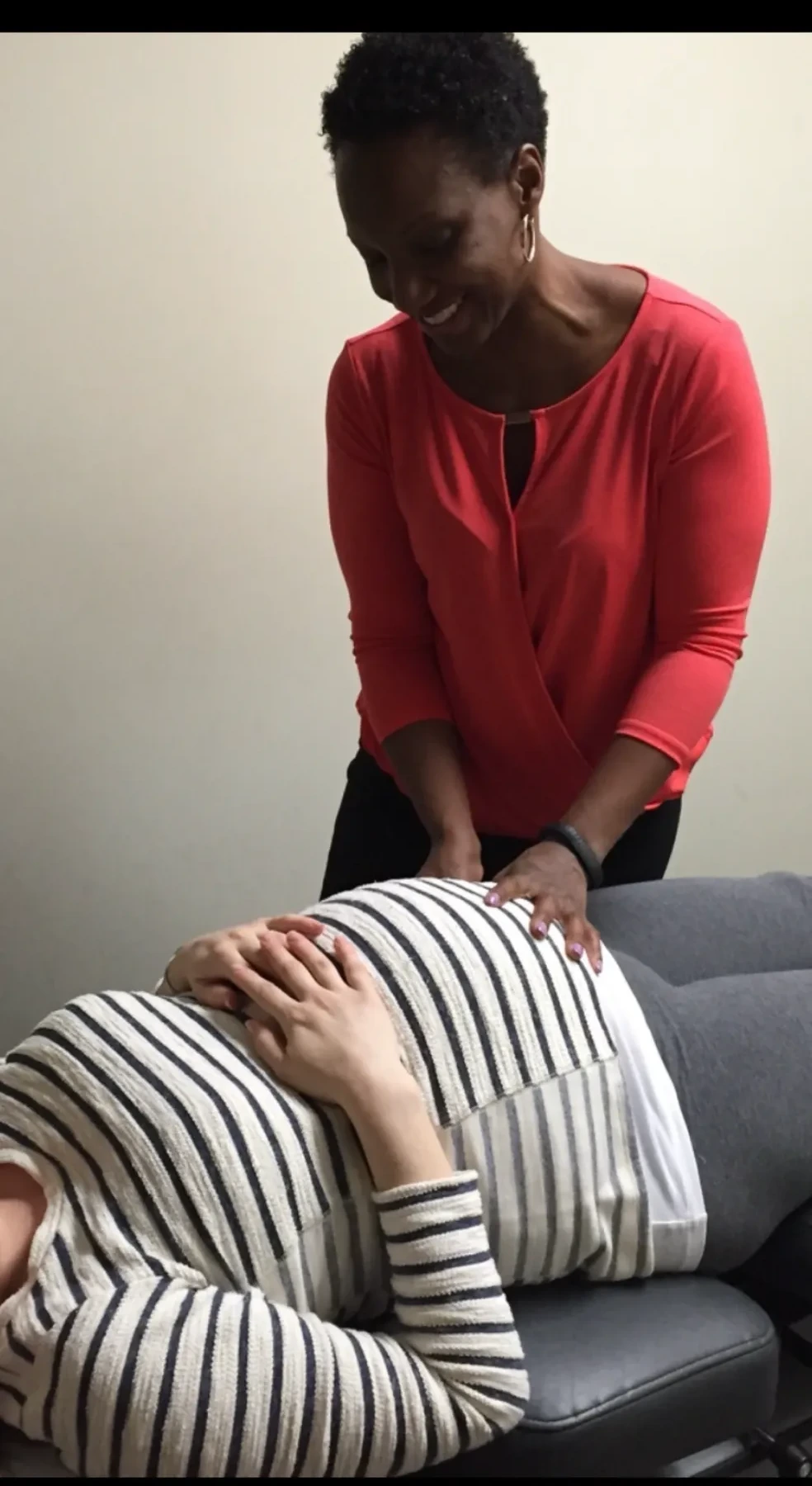 Dr. Rashida Cohen performing a chiropractic adjustment