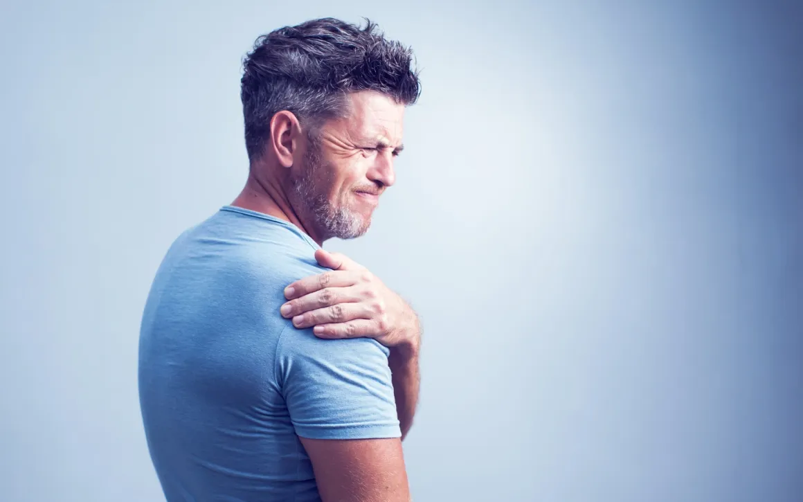 Person experiencing shoulder pain
